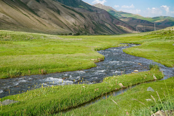 Beautiful Mountains with stream view in summer, on the way to Song Kul Lake, Kyrgyzstan 