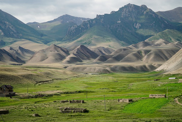 Fototapeta na wymiar Beautiful mountains landscape during summer at Song Kul Lake, Kyrgyzstan
