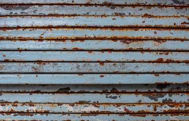 Rusty blue steel lined up