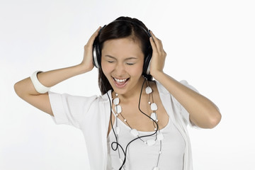 Woman listening to music on headphones