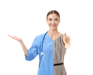 Comparison portrait of woman in uniform of doctor and formal clothes on white background