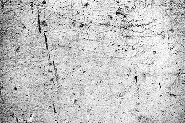 Texture of a concrete wall with cracks and scratches which can be used as a background