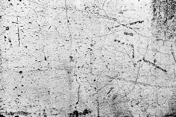 Texture of a concrete wall with cracks and scratches which can be used as a background