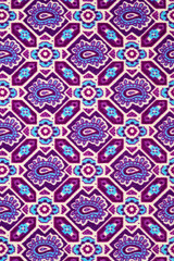 Tight stretch cotton with a bright summer print, photographed close-up.