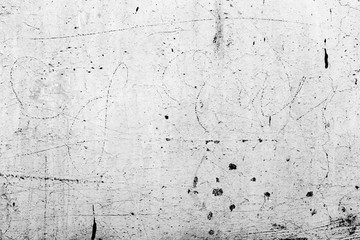 Texture of a concrete wall with cracks and scratches which can be used as a background