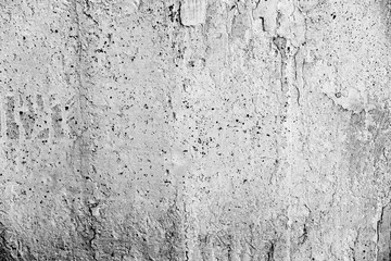 Texture of a concrete wall with cracks and scratches which can be used as a background