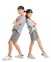 Cute little children dancing against white background