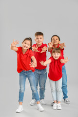 Obraz premium Cute little dancers on grey background
