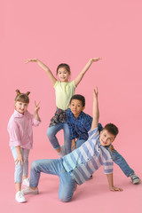 Cute little dancers on color background