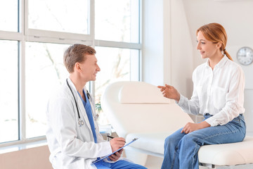 Woman visiting plastic surgeon in clinic