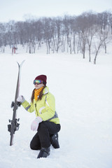 Fototapeta na wymiar Woman with skis
