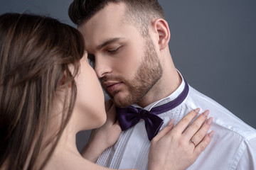 Elegand couple kissing. Touching body ecstasy and pleasure. Making love to young lover. Face sensual concept. Sensual kiss for young lovers. Affectionate couple caressing adoring each other.
