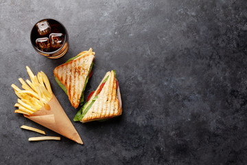 Club sandwich, potato fries chips and cola