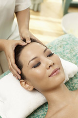 Obraz na płótnie Canvas Woman enjoying a facial massage