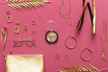 Female accessories on color background
