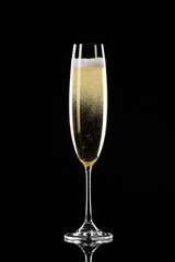 Glass of champagne on dark background