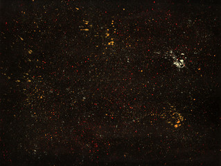 abstract background, texture, black paper with small splashes of paint