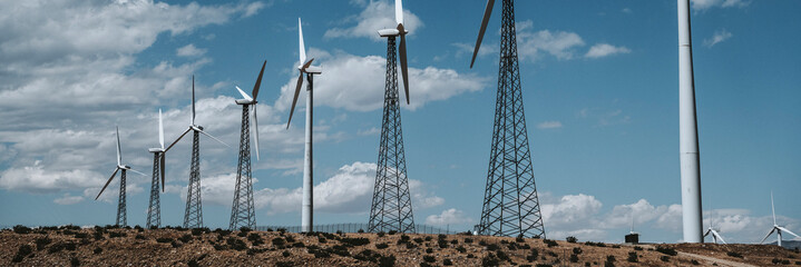 Wind turbine farm on a desert land © rawpixel.com