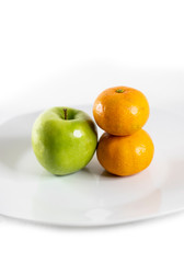 Apple and tangerines with white background