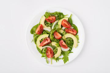 Eating clean concept. Top above overhead close-up view photo of a salad with olive oil plate placed in the center isolated on white background