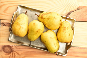 Juicy sweet, organic pears, close-up, on a wooden table.