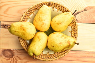 Juicy sweet, organic pears, close-up, on a wooden table.