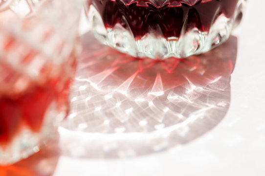 Red wine in a glass and beautiful reflection from glassware