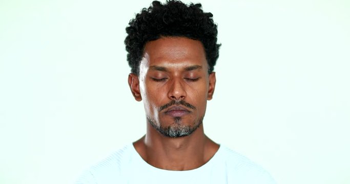 African American practicing mindfullness eyes closed in meditation