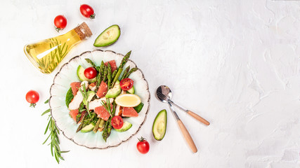 Vegetable salad with asparagus and tomato. Flat lay. Banner. Top view