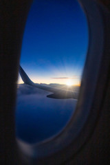Fototapeta premium Window view from an aircraft at sunrise