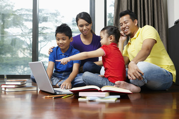 Family using laptop together