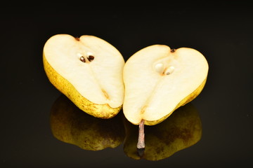 Naklejka na ściany i meble Juicy sweet, organic pears, close-up, on a black background.
