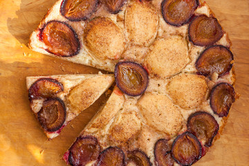 Homemade plum pie. Delicious family dessert. Home cooking