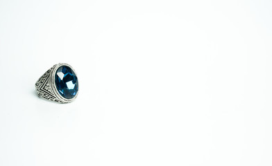 Silver ring with blue gem isolated on white background