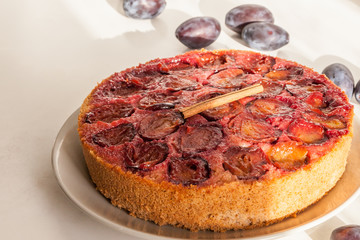 Homemade plum pie. Delicious family dessert. Home cooking