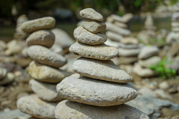 Fototapeta na wymiar Pile of stones near a river