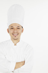 Asian chef posing with arms crossed
