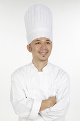Asian chef posing with arms crossed