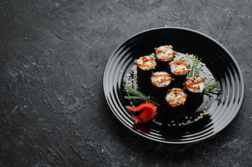 Sushi maki with eel, rice and Unagi sauce. Japanese food set. Top view