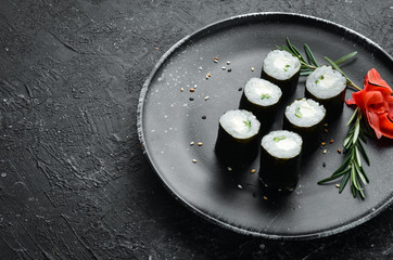 Maki rolls - Philadelphia with cheese and cucumber. Classic Japanese sushi. Top view. Free space for your text
