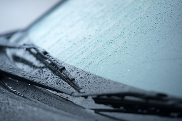 Cars parked in the rain in the rainy season and have a wiper system to clear the windshield from the windshield., Close-up car rain wipers, rainy weather and vehicles concept