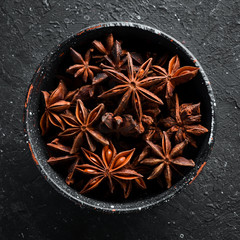 Christmas spices. Anise stars in bowls. Top view.