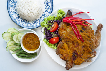 Complete meals served with fried chicken, white rice, and vegetables.  Top angle of Food photography with white background, 