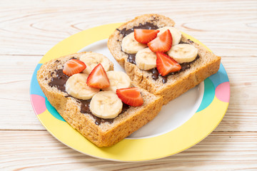 whole wheat bread with fresh banana, strawberry and chocolate
