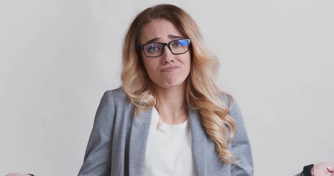 Young woman raising his hands and shaking head no