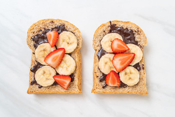 whole wheat bread with fresh banana, strawberry and chocolate