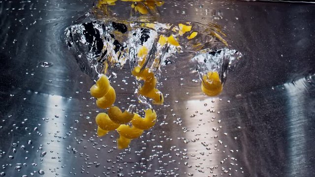 Pasta Falling Down in to the pot Slow motion 