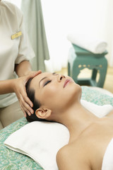 Fototapeta na wymiar Woman enjoying a facial massage