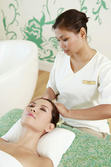 Obraz na płótnie Canvas Woman enjoying facial massage