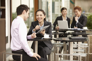 Businessman and businesswoman having discussion